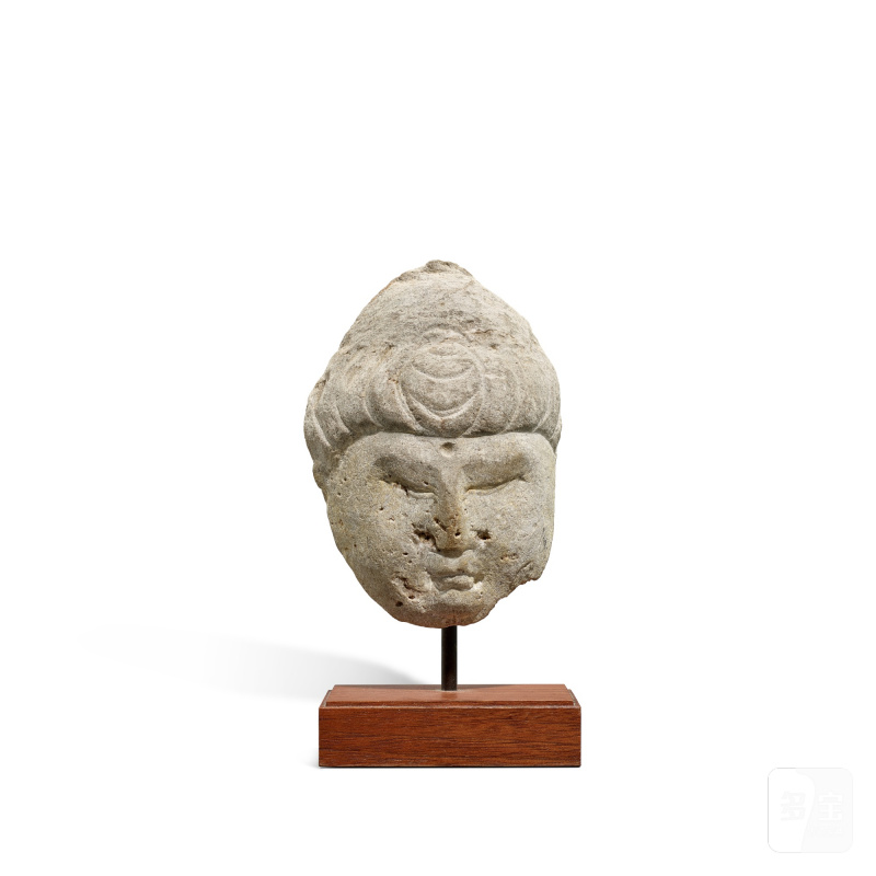 A grey marble fragment of a Buddha head, Tang dynasty | 唐 灰大理石雕佛首